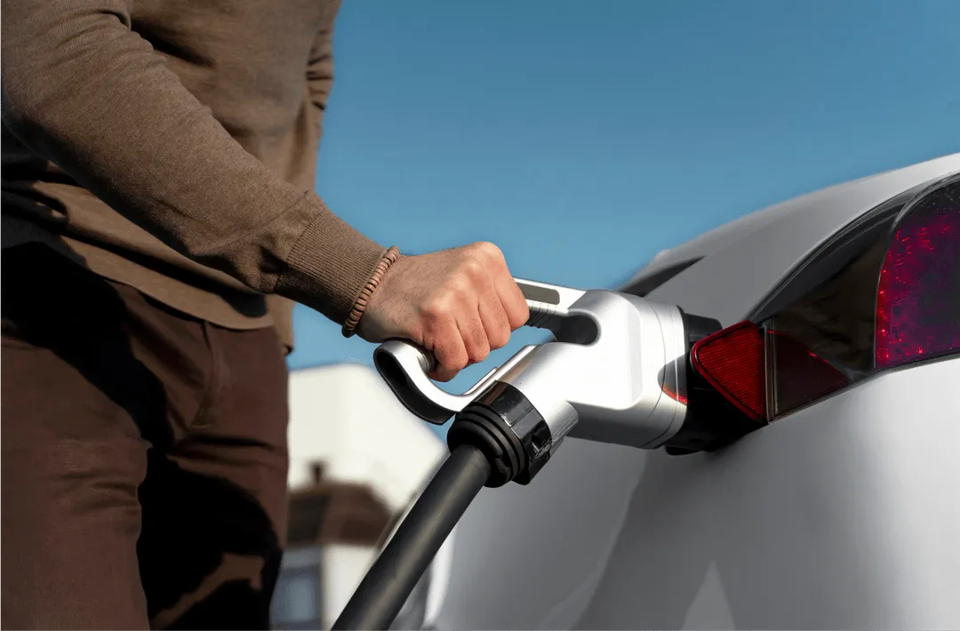 Man charging his EV car.